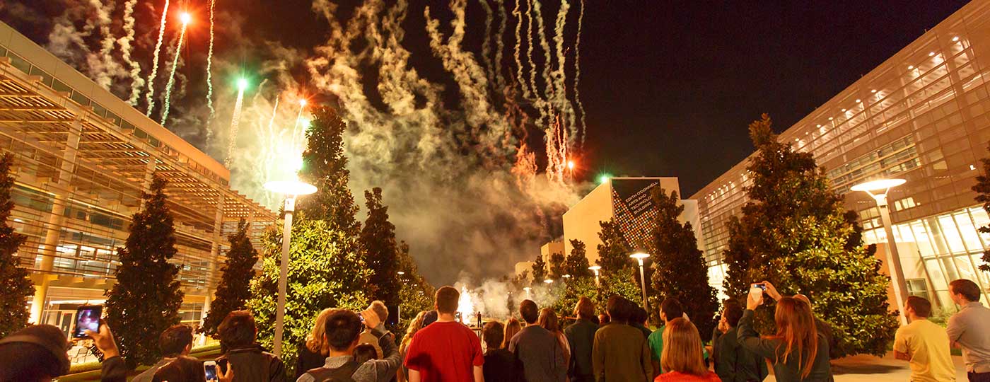 students view the fireworks at the campus mall